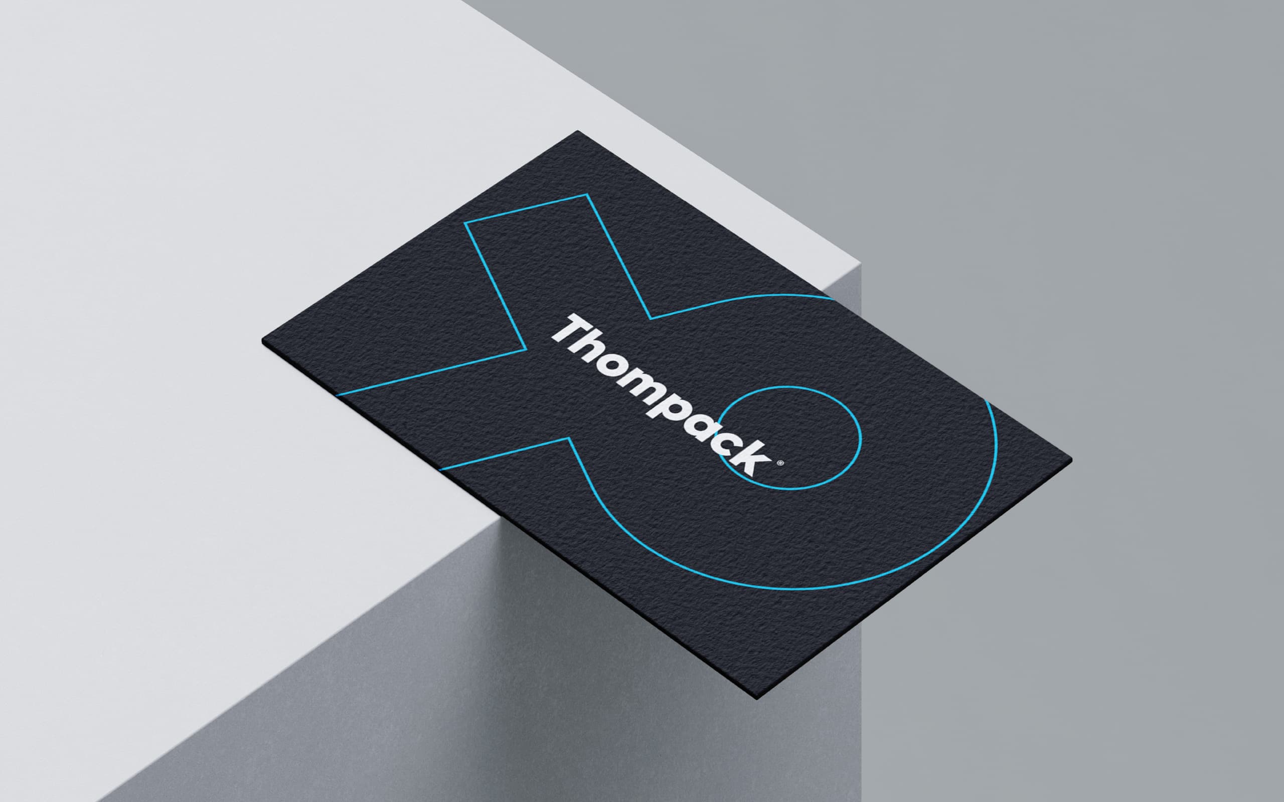 Thompack business card design for an industrial packaging and logistics brand identity system.