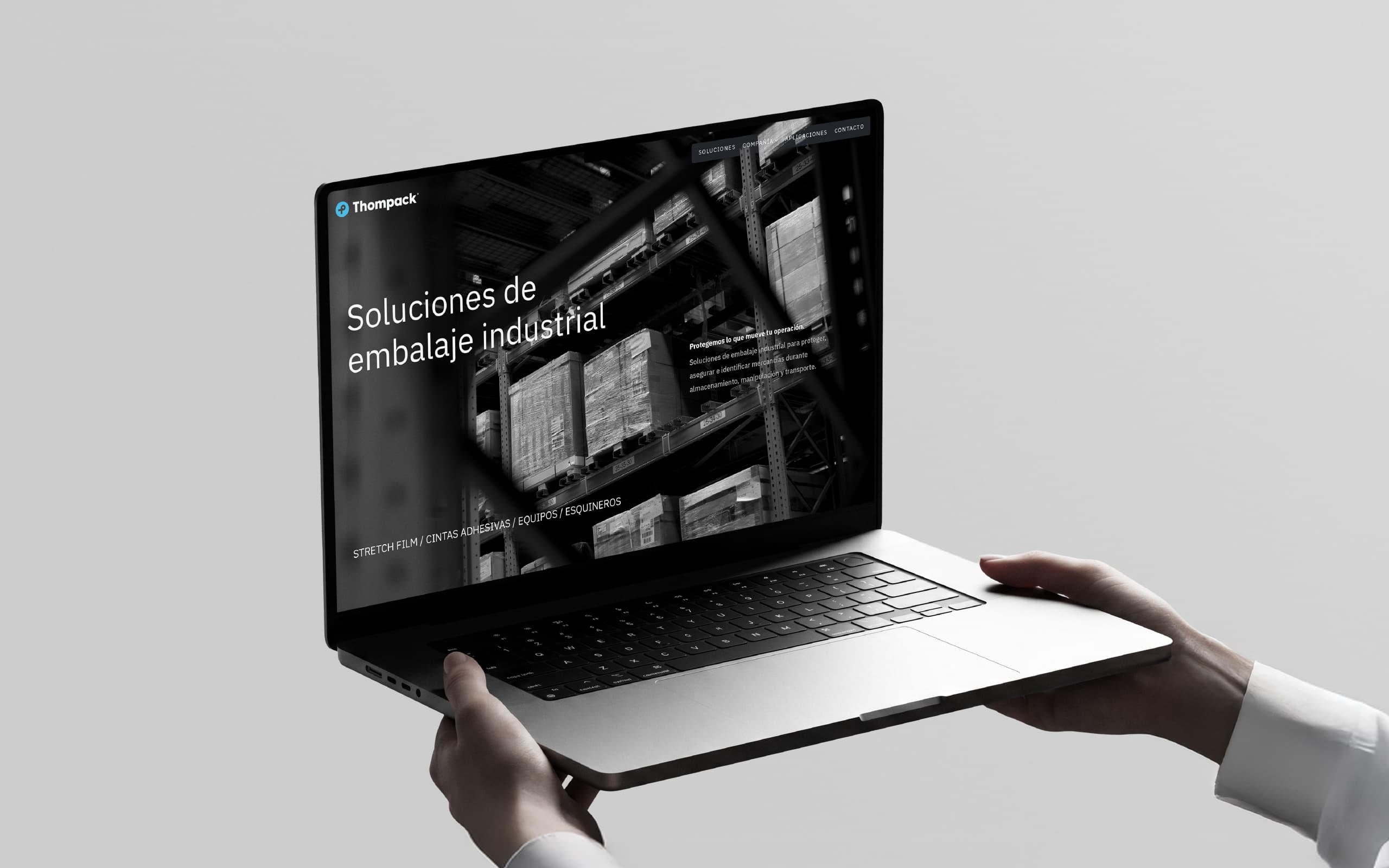 Thompack website portfolio presentation displayed on a laptop as part of the brand identity case study.